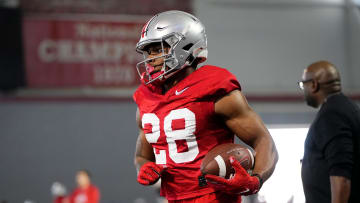 Mar 5, 2024; Columbus, OH, USA; Ohio State Buckeyes running back TC Caffey (28) runs during the first spring practice at the Woody Hayes Athletic Center.