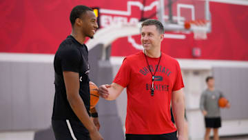 Jul 9, 2024; Columbus, OH, USA; Ohio State Buckeyes guard Micah Parrish talks to head coach Jake Diebler during a summer workout in the practice gym at the Schottenstein Center.