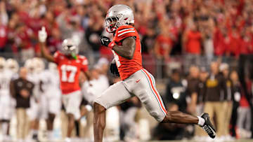 Sep 7, 2024; Columbus, Ohio, USA; Ohio State Buckeyes wide receiver Jeremiah Smith (4) runs for a touchdown after making a catch during the first half of the NCAA football game against the Western Michigan Broncos at Ohio Stadium.
