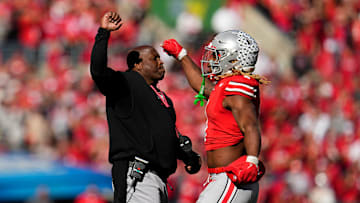 Ohio State Buckeyes running back Quinshon Judkins (1) celebrates a touchdown with running backs coach Carlos Locklyn during the second half of the NCAA football game against the Nebraska Cornhuskers at Ohio Stadium in Columbus on Saturday, Oct. 26, 2024. Ohio State won 21-17.