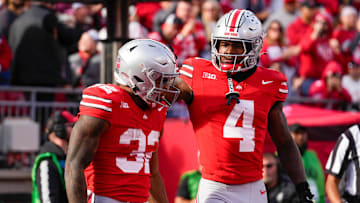 Ohio State Buckeyes running back TreVeyon Henderson (32) celebrates with wide receiver Jeremiah Smith (4) after Henderson scored a touchdown in the second half at Ohio Stadium on Saturday, Nov. 9, 2024 in Columbus, Ohio.