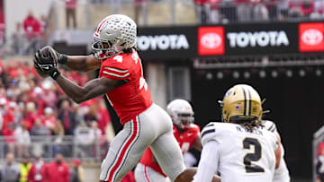 Nov 9, 2024; Columbus, Ohio, USA; Ohio State Buckeyes wide receiver Jeremiah Smith (4) catches a pass in the first half against the Purdue Boilermakers at Ohio Stadium. Mandatory Credit: Samantha Madar-Imagn Images