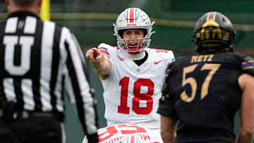 Ohio State Buckeyes quarterback Will Howard (18) calls out the defense during the NCAA football game against the Northwestern Wildcats at Wrigley Field in Chicago on Monday, Nov. 18, 2024. Ohio State won 31-7.