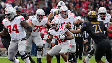Ohio State running back TreVeyon Henderson (32) runs upfield during a game against Northwestern on Nov. 16, 2024.