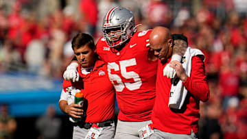 Trainers carry off Ohio State Buckeyes offensive lineman Zen Michalski (65) after during the second half of the NCAA football game against the Nebraska Cornhuskers at Ohio Stadium in Columbus on Saturday, Oct. 26, 2024. Ohio State won 21-17.