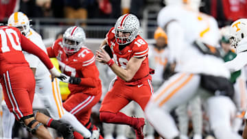 Ohio State Buckeyes quarterback Will Howard (18) rushes during the second half of the College Football Playoff first round game against the Tennessee Volunteers at Ohio Stadium in Columbus on Dec. 22, 2024. Ohio State won 42-17.