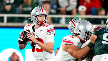 Sep 28, 2024; East Lansing, Michigan, USA; Ohio State Buckeyes quarterback Devin Brown (33) looks to pass the ball in the second half at Spartan Stadium on Saturday.