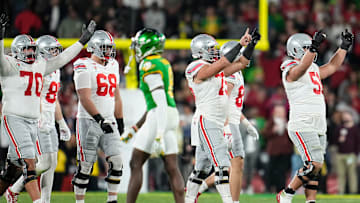 Ohio State Buckeyes offensive linemen cheer during the final seconds of the second half of the College Football Playoff quarterfinal against the Oregon Ducks at the Rose Bowl in Pasadena, Calif. on Jan. 1, 2025. Ohio State won 41-21.