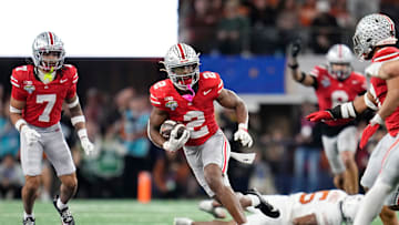 Ohio State Buckeyes safety Caleb Downs (2) returns an interception during the second half of the Cotton Bowl Classic College Football Playoff semifinal game against the Texas Longhorns at AT&T Stadium in Arlington, Texas on Jan. 10, 2025. Ohio State won 28-14.