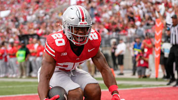 Aug 31, 2024; Columbus, OH, USA; Ohio State Buckeyes running back James Peoples (20) celebrates a touchdown during the second half of the NCAA football game against the Akron Zips at Ohio Stadium. Ohio State won 52-6.