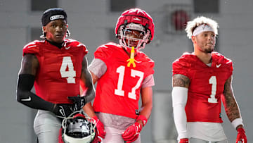 Ohio State Buckeyes wide receivers Jeremiah Smith (4), Carnell Tate (17) and Brandon Inniss (1) watch during spring football practice at the Woody Hayes Athletic Center on March 17, 2025.
