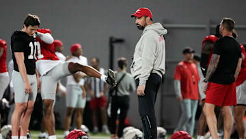 Ohio State Buckeyes head coach Ryan Day watches players stretch during spring football practice at the Woody Hayes Athletic Center in Columbus on March 19, 2025.