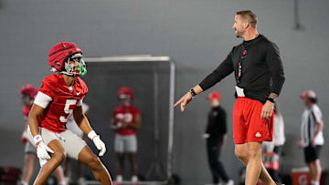 Ohio State Buckeyes offensive coordinator Brian Hartline works with wide receiver Mylan Graham (5) during spring football practice at the Woody Hayes Athletic Center on March 17, 2025.