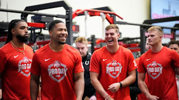Ohio State Buckeyes tight end Gee Scott Jr., linebacker Cody Simon, quarterback Will Howard and quarterback Lincoln Kienholz watch as players do the high jump during the pro day for NFL scouts at the Woody Hayes Athletic Cente on March 26, 2025.