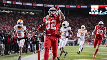 Ohio State Buckeyes running back TreVeyon Henderson (32) runs for a touchdown during the first half of the College Football Playoff first round game against the Tennessee Volunteers at Ohio Stadium in Columbus on Dec. 21, 2024.