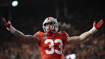 Ohio State Buckeyes defensive end Jack Sawyer (33) celebrates a sack of Tennessee Volunteers quarterback Nico Iamaleava (8) during the first half of the College Football Playoff first round game at Ohio Stadium in Columbus on Dec. 21, 2024.