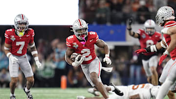 Ohio State Buckeyes safety Caleb Downs (2) returns an interception during the second half of the Cotton Bowl Classic College Football Playoff semifinal game against the Texas Longhorns at AT&T Stadium in Arlington, Texas on Jan. 10, 2025. Ohio State won 28-14.