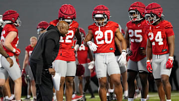 Ohio State Buckeyes running backs coach Carlos Locklyn talks to running backs, from left, C.J. Donaldson, James Peoples, Bo Jackson and Sam Williams-Dixon during spring football practice at the Woody Hayes Athletic Center on March 17, 2025.