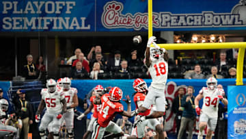Dec 31, 2022; Atlanta, Georgia, USA;  Ohio State Buckeyes wide receiver Marvin Harrison Jr. (18) can't haul in a pass over Georgia Bulldogs defensive back David Daniel-Sisavanh (14) during the second half of the Peach Bowl in the College Football Playoff semifinal at Mercedes-Benz Stadium. Ohio State lost 42-41. Mandatory Credit: Adam Cairns-The Columbus Dispatch

Ncaa Football Peach Bowl Ohio State At Georgia