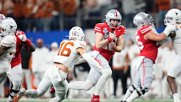 Ohio State Buckeyes quarterback Will Howard (18) runs past Texas Longhorns defensive back Michael Taaffe (16) for a first down during the second half of the Cotton Bowl Classic College Football Playoff semifinal game at AT&T Stadium in Arlington, Texas on Jan. 10, 2025. Ohio State won 28-14.