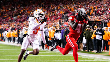 Ohio State Buckeyes wide receiver Jeremiah Smith (4) catches a touchdown pass against Tennessee Volunteers defensive back Jermod McCoy (3) in the second half at Ohio Stadium on Saturday, Dec. 21, 2024 in Columbus, Ohio.