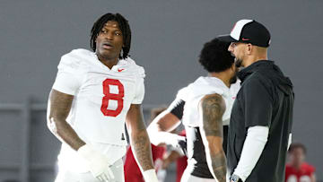 Ohio State Buckeyes linebackers coach James Laurinaitis works with linebacker Arvell Reese (8) during spring football practice at the Woody Hayes Athletic Center on March 17, 2025.