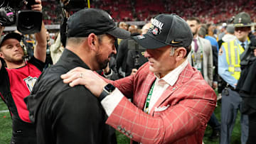 Ohio State Buckeyes head coach Ryan Day gets a hug from athletic director Ross Bjork following the 34-23 win over the Notre Dame Fighting Irish to win the College Football Playoff National Championship at Mercedes-Benz Stadium in Atlanta on Jan. 21, 2025.