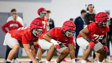 Ohio State Buckeyes offensive lineman Josh Padilla (62), offensive lineman Davontae Armstrong (73) and offensive tackle Ethan Onianwa (78) line up during spring football practice at the Woody Hayes Athletic Center on March 17, 2025.