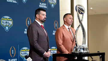 Ohio State Buckeyes head coach Ryan Day and Texas Longhorns head coach Steve Sarkisian stand together following a press conference at AT&T Stadium prior to the College Football Playoff semifinal at the Cotton Bowl Classic in Arlington, Texas on Jan. 9, 2025.