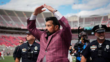 Ohio State Buckeyes head coach Ryan Day gives students an I-O response to their O-H while walking across the field as the team arrives prior to the NCAA football game against the Grambling State Tigers at Ohio Stadium on Sept. 6, 2025.