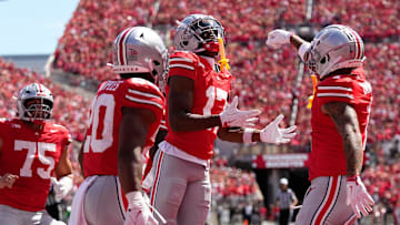Ohio State Buckeyes wide receiver Carnell Tate (17) celebrates a touchdown catch with wide receiver Brandon Inniss (1) and DUPLICATE***running back James Peoples (20)***linebacker Riley Pettijohn (20) during the NCAA football game against the Texas Longhorns at Ohio Stadium on Aug. 30, 2025.