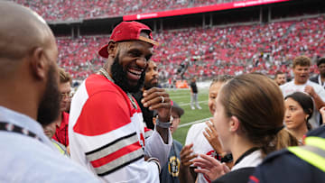 LeBron James talks to fans prior to the NCAA football game between the Ohio State Buckeyes and Notre Dame Fighting Irish at Ohio Stadium.