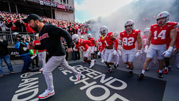 Ohio State Buckeyes head coach Ryan Day leads his team onto the field prior to the NCAA football game against the Rutgers Scarlet Knights at Ohio Stadium in Columbus on Nov. 22, 2025.