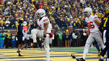 Ohio State Buckeyes wide receiver Brandon Inniss (1) celebrates a touchdown during the NCAA football game against the Michigan Wolverines at Michigan Stadium in Ann Arbor, Mich. on Nov. 29, 2025.