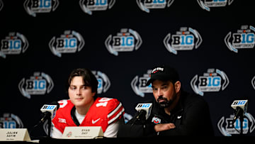 Ohio State Buckeyes head coach Ryan Day and quarterback Julian Sayin talk to media following the Big Ten Conference championship game against the Indiana Hoosiers at Lucas Oil Stadium in Indianapolis on Dec. 6, 2025. Ohio State lost 13-10.