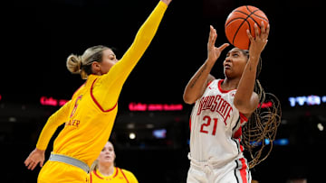 Ohio State Buckeyes guard Chance Gray (21) shoots around Maryland Terrapins guard Saylor Poffenbarger (6) during the second half of the NCAA women's basketball game at Value City Arena on Jan. 23, 2025. Ohio State won 74-66.