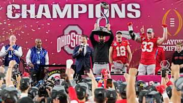 Ohio State Buckeyes head coach Ryan Day hoists the Field Scovell Trophy following the 28-14 win over the Texas Longhorns in the Cotton Bowl Classic College Football Playoff semifinal game at AT&T Stadium in Arlington, Texas on Jan. 10, 2025.