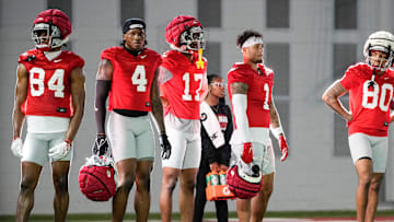 Ohio State Buckeyes wide receivers Dorian Williams (84), Jeremiah Smith (4), Carnell Tate (17), Brandon Inniss (1) and Shawn Lodge (80) watch during spring football practice at the Woody Hayes Athletic Center on March 17, 2025.