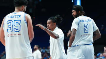 Kentucky La Familia head coach Tyler Ulis, center, encourages Kerem Kanter (35) against The Nawf during the TBT tournament at Rupp Arena in Lexington, Ky. on July 21, 2024.