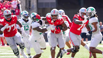 Sep 21, 2024; Columbus, Ohio, USA; Ohio State Buckeyes running back TreVeyon Henderson (32) still arms Marshall Thundering Herd linebacker Landyn Watson (9) in the second half at Ohio Stadium on Saturday.
