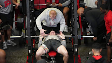 Mar 20, 2024; Columbus, Ohio, USA; Ohio State Buckeyes linebacker Tommy Eichenberg is spotted by strength coach Zachary Higgins as he bench presses for NFL scouts during Pro Day at the Woody Hayes Athletic Center.
