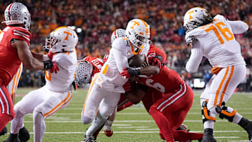 Nico Iamaleava runs for a touchdown during the first half of the College Football Playoff first-round game.