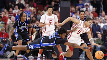 Nov 27, 2025; Chicago, Illinois, USA; Arkansas Razorbacks guard Darius Acuff Jr. (5) battles for the ball with Duke Blue Devils center Patrick Ngongba (21) during the second half at United Center. Mandatory Credit: Kamil Krzaczynski-Imagn Images