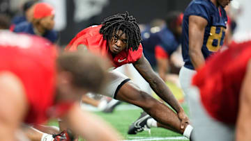 Ohio State Buckeyes wide receiver Jeremiah Smith (4) stretches during practice for the College Football Playoff against the Notre Dame Fighting Irish at the Mercedes-Benz Stadium in Atlanta on Jan. 18, 2025.