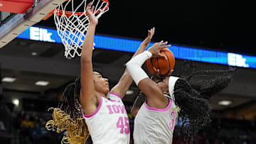 Ohio State Buckeyes forward Cotie McMahon (32) attempts to shoot the ball against Iowa Hawkeyes forward Hannah Stuelke (45) in the second half at Value City Arena on Monday, Feb. 17, 2025 in Columbus, OH.   Mandatory Credit: Samantha Madar/USA TODAY NETWORK via Imagn Images