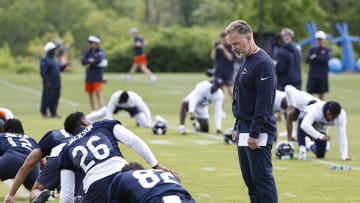 Jun 5, 2024; Lake Forest, IL, USA; Chicago Bears head coach Matt Eberflus talks with Chicago Bears wide receiver John Jackson (26) during the team's minicamp at Halas Hall. Mandatory Credit: Kamil Krzaczynski-USA TODAY Sports