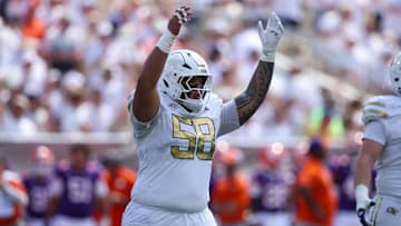Sep 13, 2025; Atlanta, Georgia, USA; Georgia Tech Yellow Jackets offensive lineman Tana Alo-Tupuola (58) reacts after a play against the Clemson Tigers in the first quarter at Bobby Dodd Stadium at Hyundai Field. Mandatory Credit: Brett Davis-Imagn Images