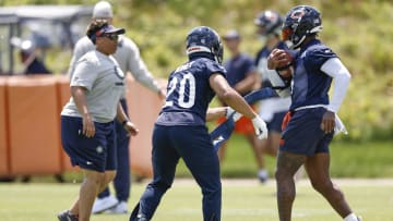 May 23, 2024; Lake Forest, IL, USA; Chicago Bears running backs Travis Homer (20) and D'Andre Swift (4) warm up during organized team activities at Halas Hall Mandatory Credit: Kamil Krzaczynski-USA TODAY Sports