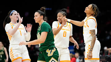Tennessee Lady Vols guard Sara Puckett (1) and guard Jewel Spear (0) high five guard Ruby Whitehorn (2) behind South Florida Bulls guard Vittoria Blasigh (5) during the first round of the NCAA Women's Basketball Tournament at Value City Arena in Columbus, Ohio on March 21, 2025.