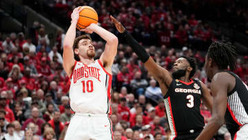 Mar 26, 2024; Columbus, OH, USA; Ohio State Buckeyes forward Jamison Battle (10) shoots a three-pointer over Georgia Bulldogs guard Noah Thomasson (3) during the first half of the NIT quarterfinals at Value City Arena.